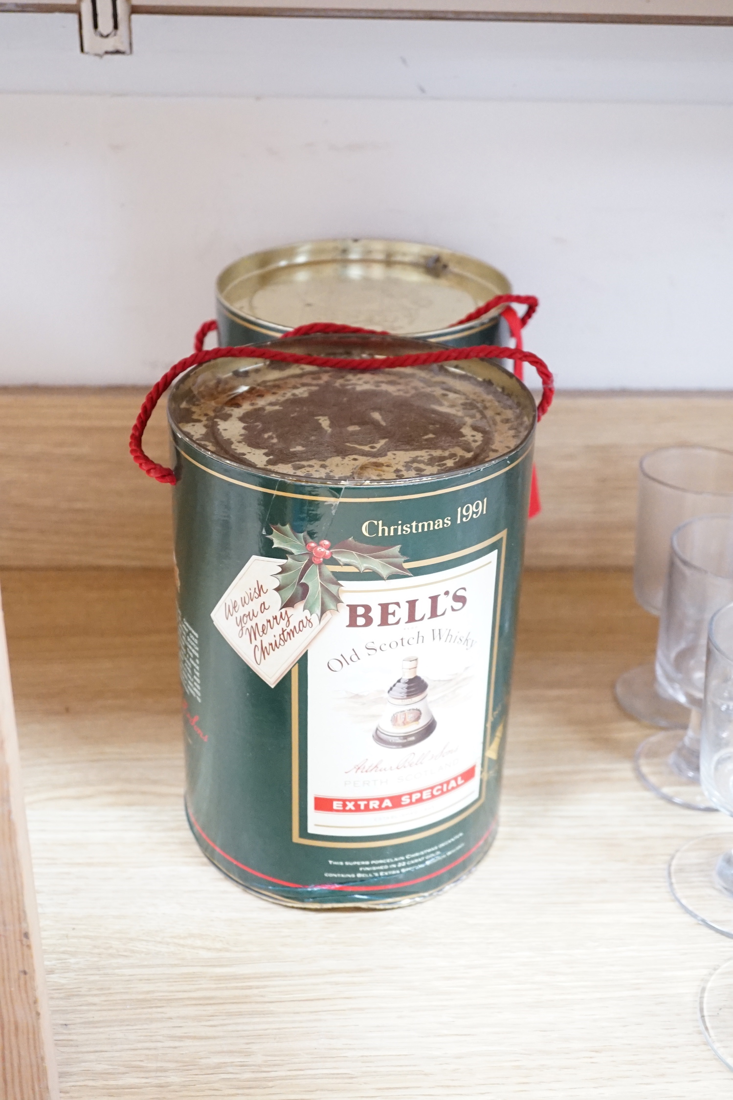 Five Christmas or New year Bell's whisky bottles, three in tins and one boxed